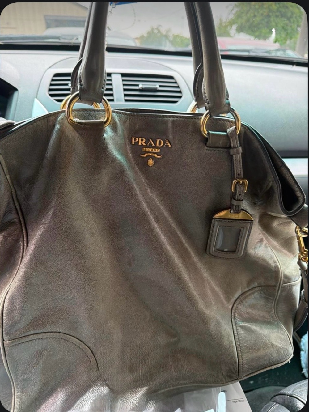 Prada Vitello Shine tote. 
Gold hardware